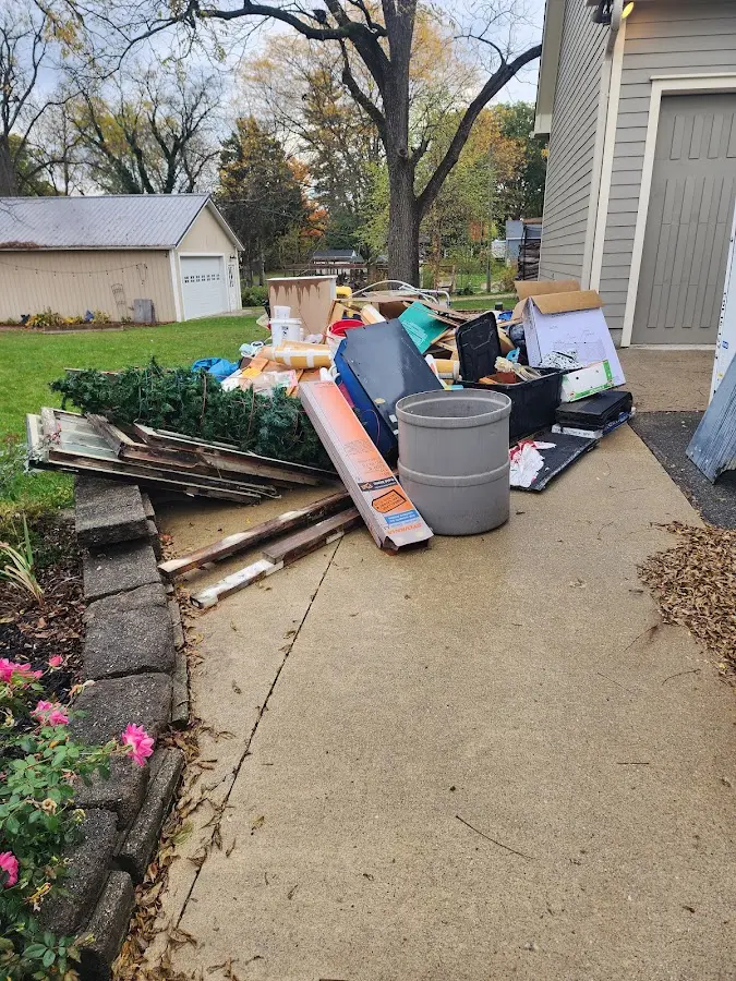 Dumpster being loaded with debris for Residential Dumpster Rental in Marshfield